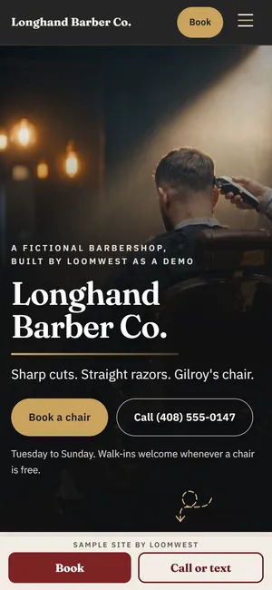 The first screen of the Longhand Barber Co. example site (The Barbershop) on a phone